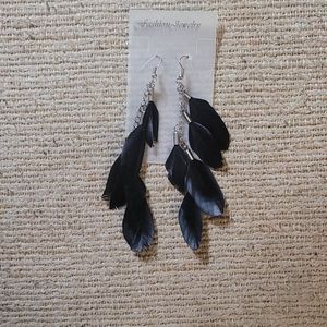 5/$25 New. Black feathered dangle earrings.